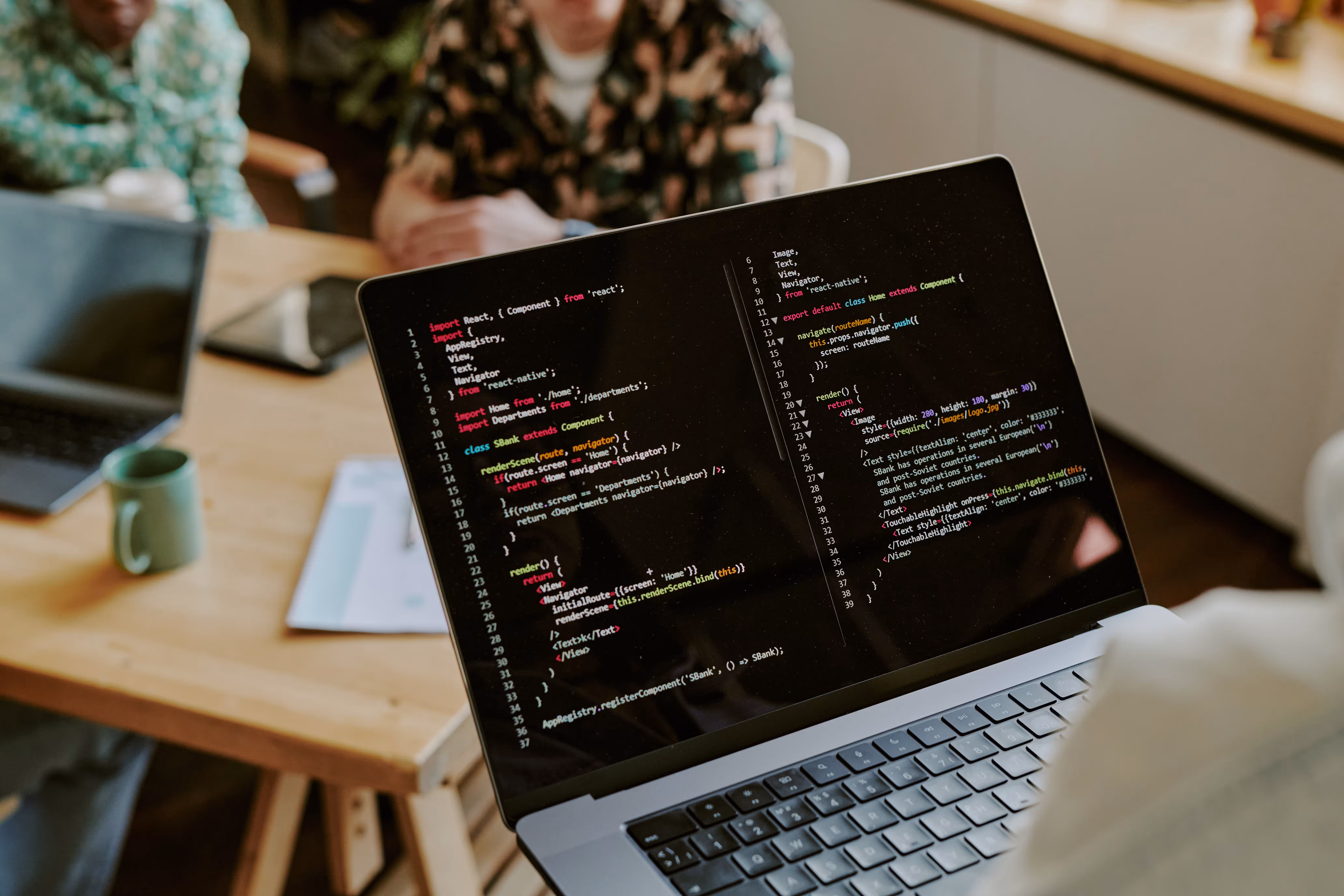 Website Developer coding on a laptop