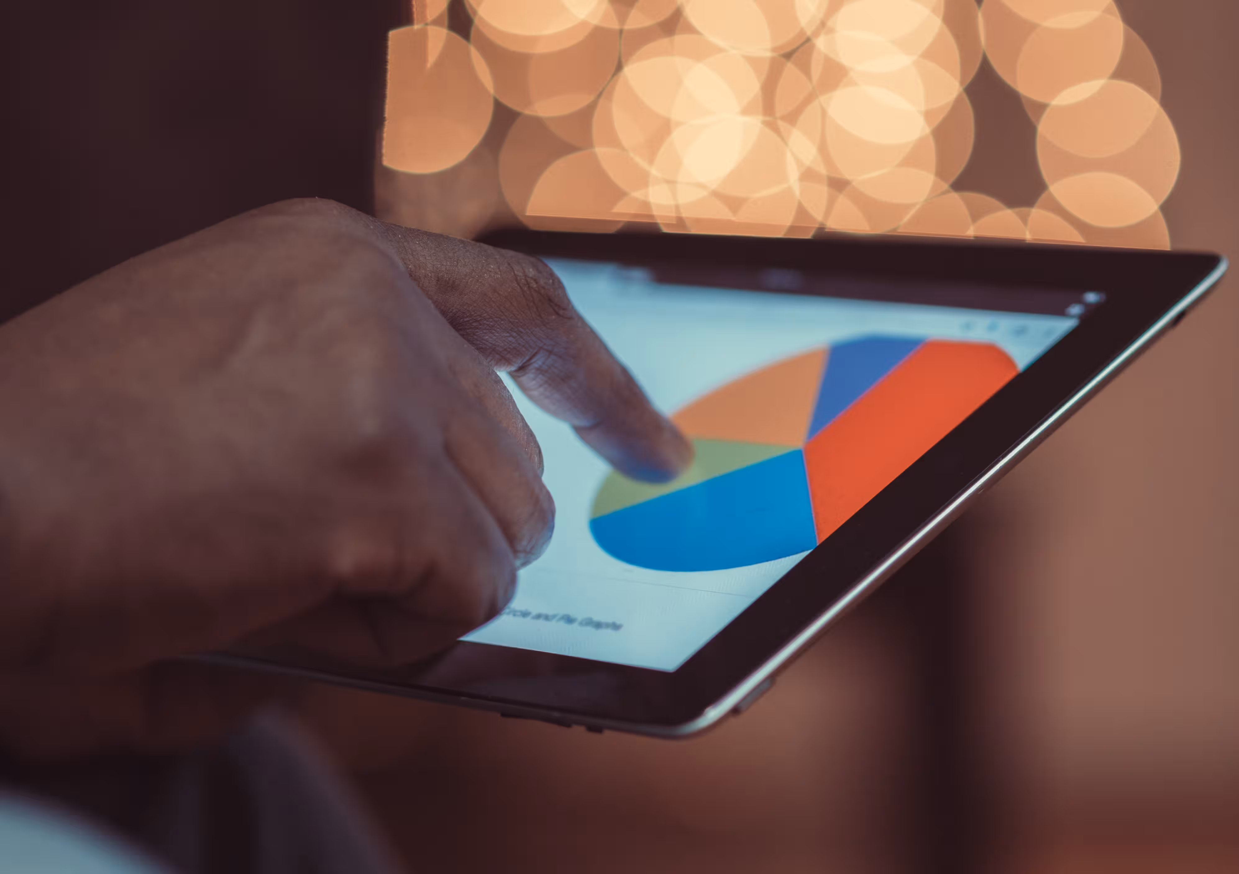 Person looking at analytics on a tablet