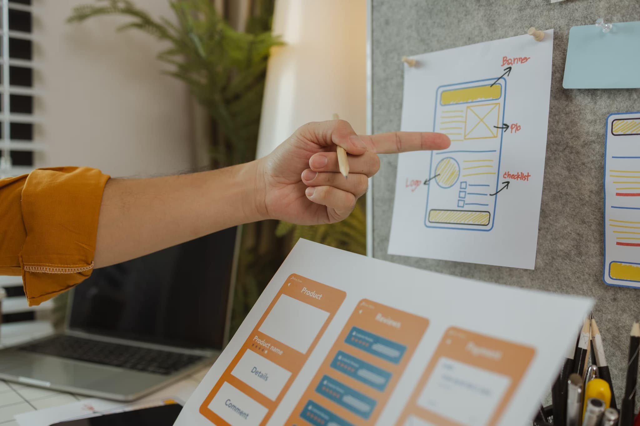 A website designer showing UX and UI design