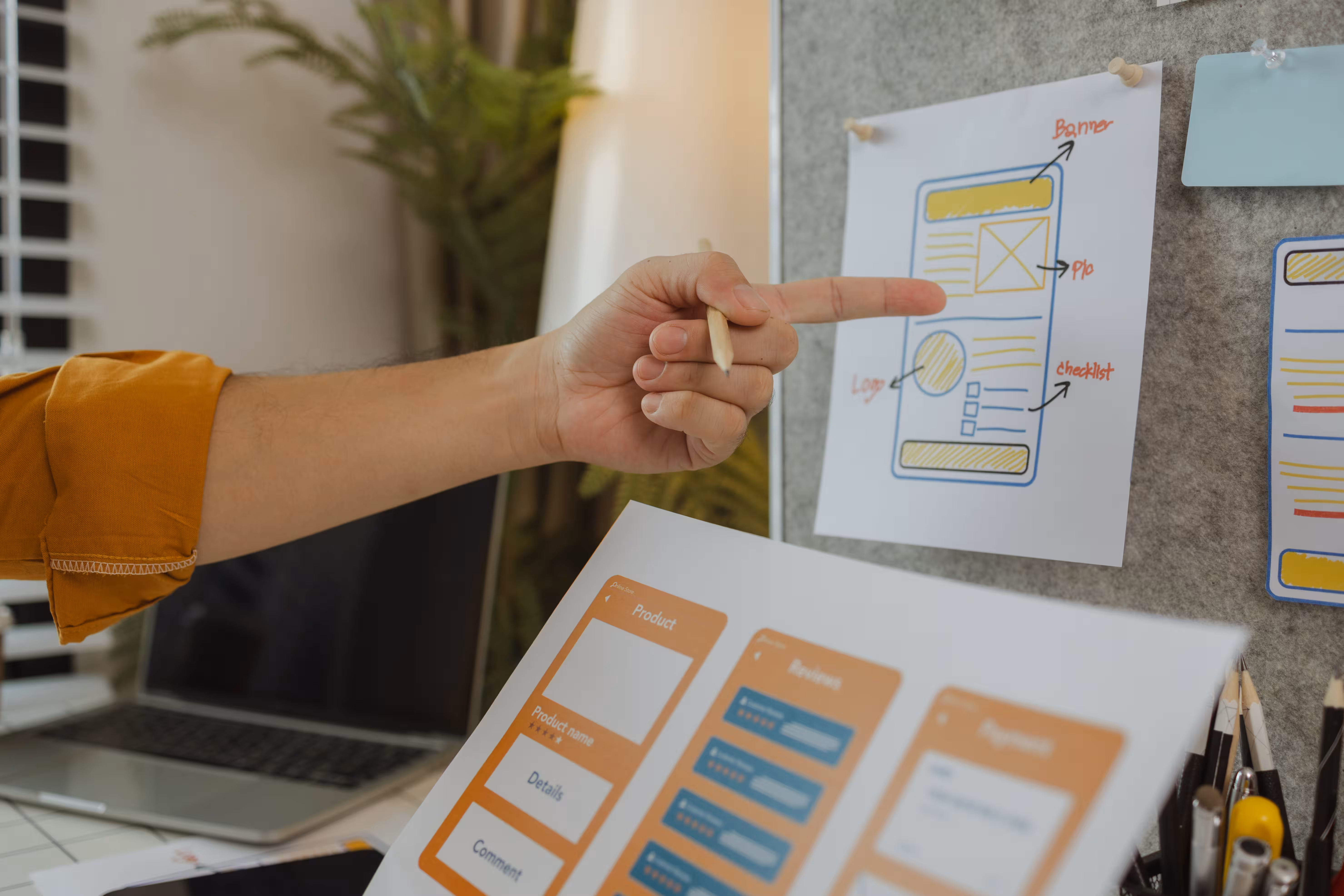 A website designer showing UX and UI design