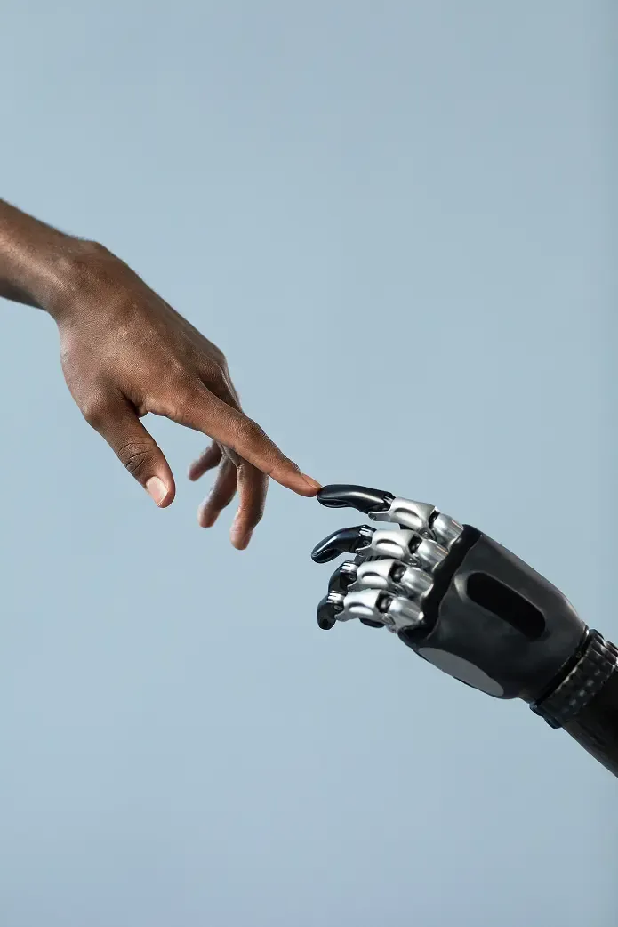 Human hand and robot hand touching
